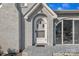 Close up of the home's entrance showcasing the beautiful white brick and arched features at 203 E 22Nd St, Kannapolis, NC 28083