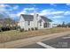 Exterior home view featuring mature landscaping, a brick facade, and easy street access at 203 E 22Nd St, Kannapolis, NC 28083