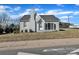 View of home featuring mature landscaping, a brick facade, and easy street access at 203 E 22Nd St, Kannapolis, NC 28083