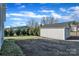 Detached one-car garage with a white exterior and asphalt driveway at 203 E 22Nd St, Kannapolis, NC 28083