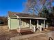 Charming one-story house with a covered front porch, creating a welcoming entry and inviting outdoor relaxation at 2124 W C St, Kannapolis, NC 28081