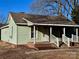 Charming home with a porch, featuring bright siding and a classic architectural style at 2124 W C St, Kannapolis, NC 28081