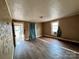 Bright living room featuring hardwood floors, natural light, and inviting space for relaxation and entertainment at 2124 W C St, Kannapolis, NC 28081
