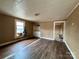 This living room is ready for your creativity, featuring hardwood floors, built-in storage, and natural light at 2124 W C St, Kannapolis, NC 28081