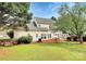 Home with backyard including a patio and wood deck, providing ample outdoor space at 2217 Heath Lake Dr, Mint Hill, NC 28227
