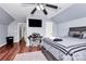 Bedroom with vaulted ceilings, gray walls, ceiling fan, and laminate wood flooring at 2217 Heath Lake Dr, Mint Hill, NC 28227