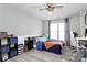 Bedroom with laminate flooring, a ceiling fan, and a large sunny window at 2217 Heath Lake Dr, Mint Hill, NC 28227