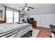 Bedroom with vaulted ceilings, gray walls, ceiling fan, and laminate wood flooring at 2217 Heath Lake Dr, Mint Hill, NC 28227