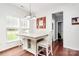 Bright dining area with wood floors, and a view into another room at 2217 Heath Lake Dr, Mint Hill, NC 28227