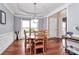 Elegant dining room with hardwood floors, a modern chandelier, and classic wainscoting at 2217 Heath Lake Dr, Mint Hill, NC 28227