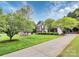 Classic red brick home with a long driveway and expansive front yard at 2217 Heath Lake Dr, Mint Hill, NC 28227