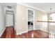 Upstairs hallway with hardwood floors and plenty of light at 2217 Heath Lake Dr, Mint Hill, NC 28227
