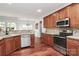Well-equipped kitchen featuring stainless steel appliances and stylish wooden cabinetry at 2217 Heath Lake Dr, Mint Hill, NC 28227