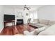 Comfortable living room with a fireplace, ceiling fan, and cozy seating at 2217 Heath Lake Dr, Mint Hill, NC 28227
