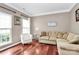 Cozy living room with a neutral color palette, hardwood floors, and bright, natural light at 2217 Heath Lake Dr, Mint Hill, NC 28227