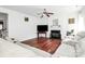Bright living room with a fireplace, ceiling fan, and comfortable seating at 2217 Heath Lake Dr, Mint Hill, NC 28227