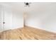 Bright bedroom boasts hardwood floors, white walls, modern lighting, and a spacious feel at 2965 Beech Nut Rd, Charlotte, NC 28208