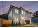 The side of the house showing the windows, gray siding, and fenced front yard at 2965 Beech Nut Rd, Charlotte, NC 28208