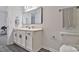 Bathroom featuring white cabinets, framed mirror, and white vinyl flooring at 3099 Windsor Trace Dr, Fort Mill, SC 29707