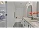 Bathroom featuring granite double vanity, black hardware, framed mirrors, and view to private balcony at 3099 Windsor Trace Dr, Fort Mill, SC 29707