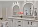 Bathroom featuring granite double vanity, black hardware, and framed mirrors at 3099 Windsor Trace Dr, Fort Mill, SC 29707