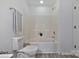 Cozy bathroom area featuring a shower and tub combination with a toilet and accent towel at 3099 Windsor Trace Dr, Fort Mill, SC 29707