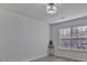 Bedroom with chandelier lighting, large windows, and modern decor at 3099 Windsor Trace Dr, Fort Mill, SC 29707