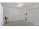 Carpeted bedroom with closet space and a view to the bathroom at 3099 Windsor Trace Dr, Fort Mill, SC 29707
