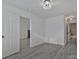 Bright bedroom with recessed lighting and ensuite bathroom access features gray plank flooring at 3099 Windsor Trace Dr, Fort Mill, SC 29707