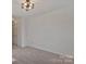 Spacious bedroom with neutral carpet and modern ceiling light at 3099 Windsor Trace Dr, Fort Mill, SC 29707