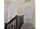 Second-floor hallway with modern railing offers views of the lower level and access to bedrooms at 3099 Windsor Trace Dr, Fort Mill, SC 29707