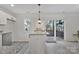 Bright kitchen featuring granite countertops, stainless steel appliances, and access to deck at 3099 Windsor Trace Dr, Fort Mill, SC 29707