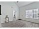 Bright living room showcasing vaulted ceilings, natural light, and modern flooring at 3099 Windsor Trace Dr, Fort Mill, SC 29707