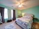 This bedroom has neutral walls, large windows, ceiling fan, and carpeted floors at 3841 Shasta Cir, Clover, SC 29710