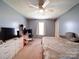 Well-lit bedroom with a ceiling fan, large windows, and spacious layout at 3841 Shasta Cir, Clover, SC 29710