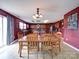 Spacious dining room features wood table, matching chairs and decorative lighting with tile floors at 3841 Shasta Cir, Clover, SC 29710