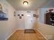 Bright foyer featuring tile flooring, a 'Gathering' decorative sign, and a well-lit entryway at 3841 Shasta Cir, Clover, SC 29710