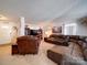 Spacious living room with a leather sectional and recliner, creating a cozy gathering space at 3841 Shasta Cir, Clover, SC 29710