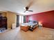 Spacious main bedroom features a ceiling fan, large windows, and a gray and red accent wall at 3841 Shasta Cir, Clover, SC 29710