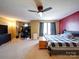 The large main bedroom has carpet, a ceiling fan, and space for a desk and seating area at 3841 Shasta Cir, Clover, SC 29710