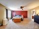 This main bedroom has a ceiling fan, a window for natural light, and access to the ensuite bathroom at 3841 Shasta Cir, Clover, SC 29710