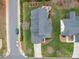 Aerial view of home highlighting the roof, lawn, patio, and driveway at 4032 River Falls Dr, Lowell, NC 28098