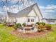 Lovely backyard featuring a patio with a fire pit and outdoor seating area at 4032 River Falls Dr, Lowell, NC 28098