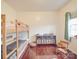 Charming bedroom with hardwood floors and a cozy bunk bed at 4032 River Falls Dr, Lowell, NC 28098