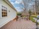 Well maintained wood deck with outdoor seating and a grill at 4032 River Falls Dr, Lowell, NC 28098