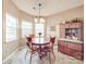 Cozy dining nook is filled with sunlight and features a wood table and chairs at 4032 River Falls Dr, Lowell, NC 28098