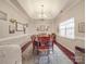 Elegant dining room featuring a tray ceiling, a chandelier, and a large window at 4032 River Falls Dr, Lowell, NC 28098