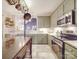 Updated kitchen featuring stainless appliances and a convenient open concept layout at 4032 River Falls Dr, Lowell, NC 28098