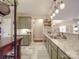 Updated kitchen features stainless steel appliances and granite countertops and open floor plan at 4032 River Falls Dr, Lowell, NC 28098