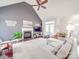 Open living room featuring high ceilings, a cozy fireplace, and bright windows at 4032 River Falls Dr, Lowell, NC 28098